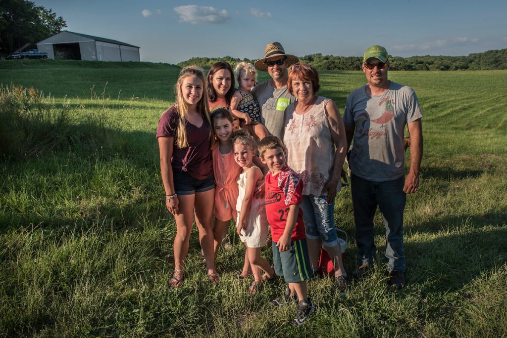 Vicki Duran, three of her children, and five of her grandchildren pose for a rare family portrait. Vicki and her children Abby, Dan and Sam (from left to right), each have homes theyve built themselves, on the family farm. Families in Washington Co., Pa who are facing possible issues through the creation of cybergentic gas processing plant in western Pa. Durant Farm, they are one of the older and more influential families in this part of Washington Co. They live in Bulger, Pa Sam and Kasey live on a hill and from their house they'll see two possible processing plants, one is on their grand-uncle's property which was sold by his wife to ETC and Mark West Show Matriarch is Vicki Duran in center, her sons, Dan(left) and Sam (rt) flank her. Sam is holding his daughter, next to him is his sister Abby Rodriguez, rest are grandkids. They are bailing hay on their farms and they grow a few angus cattle, the children raise goats, pigs and lambs for 4-H. Smith Township